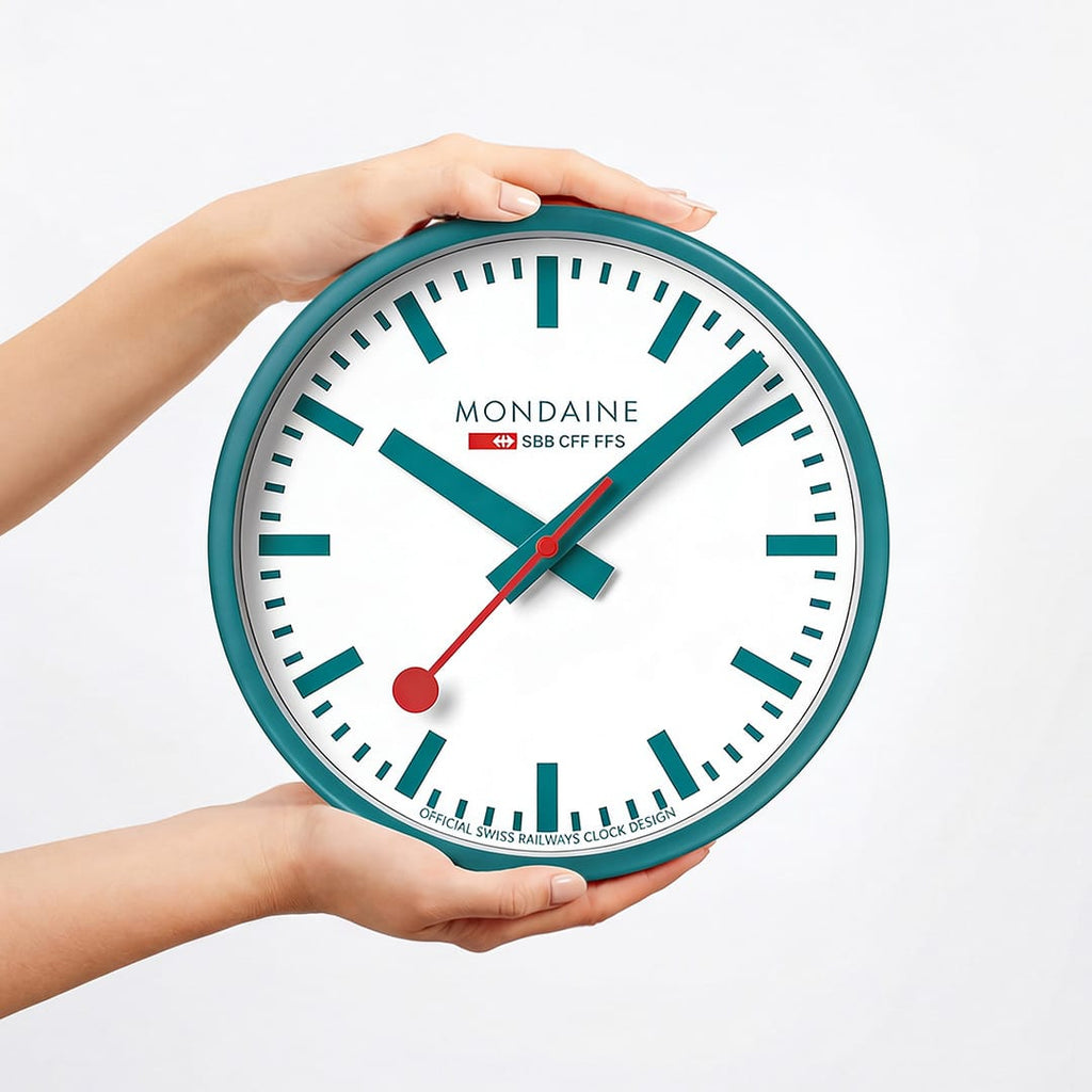 Mondaine Wall Clock Transformative Teal Frame 25 cm A990.CLOCK.10SBD