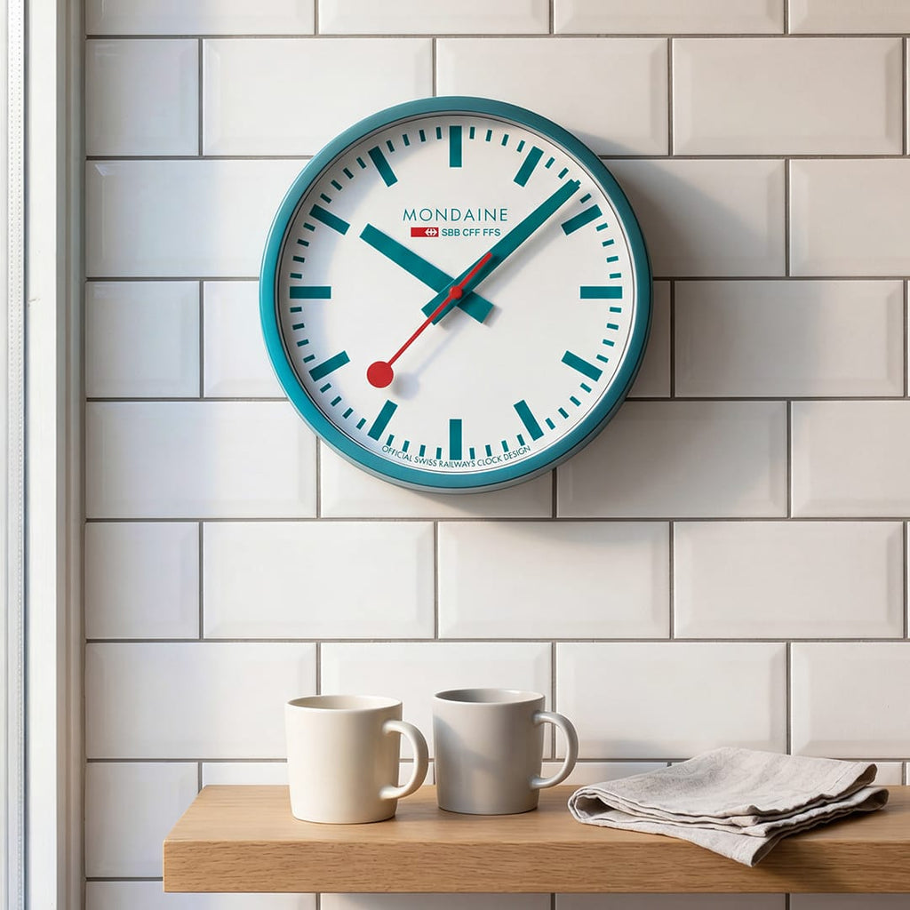 Mondaine Wall Clock Transformative Teal Frame 25 cm A990.CLOCK.10SBD