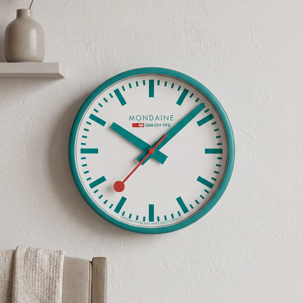 Mondaine Wall Clock Transformative Teal Frame 25 cm A990.CLOCK.10SBD