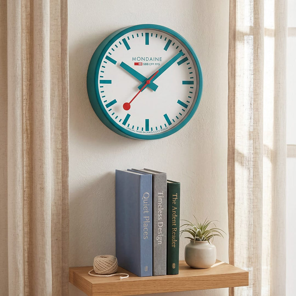 Mondaine Wall Clock Transformative Teal Frame 25 cm A990.CLOCK.10SBD